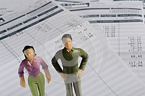 Euro Payroll and woman and man figurine