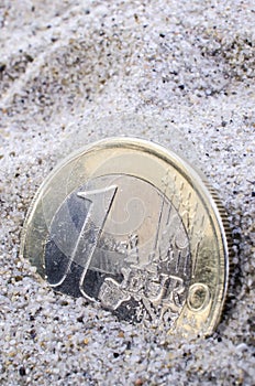 Euro in sand