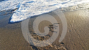 Euro sign on the beach