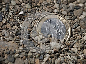 Euro sinking in gritty sand, metaphor