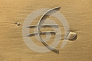 Euro symbol drawn in the sand