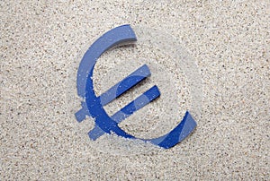 Euro symbol in the sand