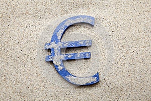 Euro symbol in the sand