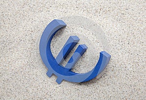 Euro symbol in the sand