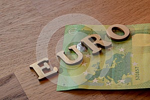 euro word concept made of wooden letters euro on wooden background with flag of European Union