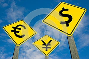Euro, yen and dollar symbols on road sign. photo
