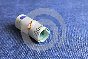 Eurocurrency rolls on a blue background photo