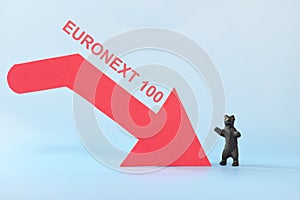 Euronext 100 index in red downward arrow with decreasing stack of coins. Bearish run in Europe European stock market. photo
