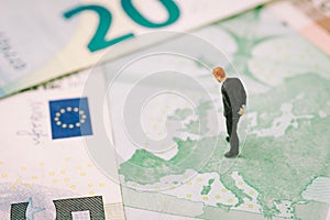 Europe, Brexit or Britain economy or financial concept, miniature figure businessman country leader standing on European map on E