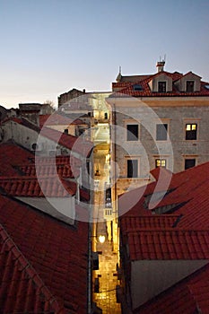 Europe, Croatia, old town Dubrovnik rooftops view and narrow street with lights