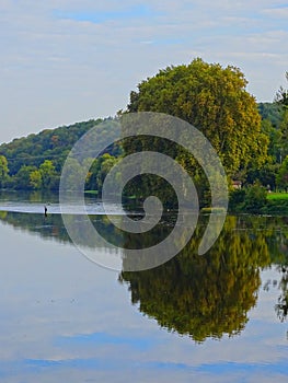 Europe, France, New Aquitaine, Charente,Confolens, fisherman on the river La Vienne