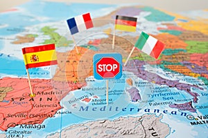 Europe lockdown concept image stop Coronavirus flags of Italy, Germany, France, Spain on map, travel restrictions border shutdown