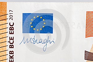 Europe union flag and Mario Draghi`s signature on 50 Euro banknote. photo