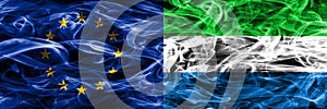 Europe Union and Sierra Leone colorful concept smoke flags place