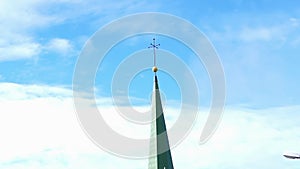 European architect detail weather vane and directional point on tower top with blue sky copy space