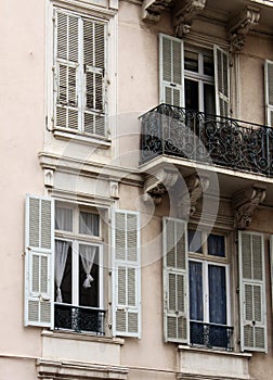 European architectural building with balconies and window shutters