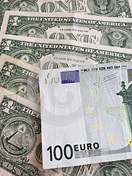 European banknote of 100 euro and american one dollar bills