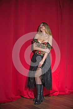 European blonde woman in ethno modern clothes