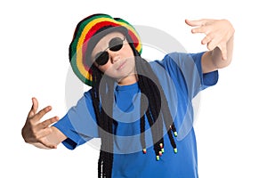 European boy in a cap with dreadlocks sings rap