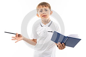 European boy reasoning with a book and pen in his hands on a white background