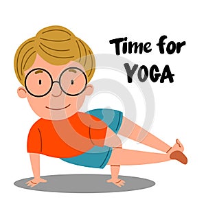 A European boy is standing on two hands, holding a balance. The child is engaged in sports. Time for yoga