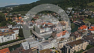 European city. A small town in swiss. Terracotta roof of houses. Forest. Summer. Residential area. River. Multistory