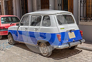 European classic old car parked on a street in a town