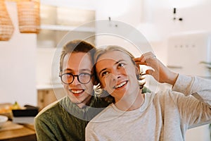 European gay couple hugging and smiling while spending time together