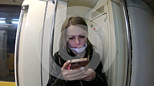 a European girl rides in the Moscow metro