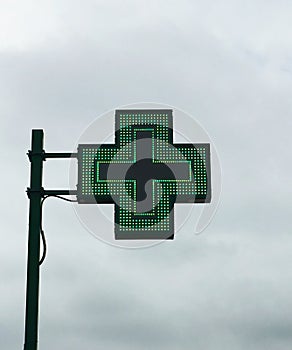 European green cross pharmacy store sign: Farmacia. Pharmacy sign. photo