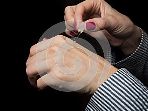 European hands of a woman with Arabian perfume oil