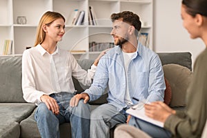European husband and wife reconciling after marriage therapy session indoor