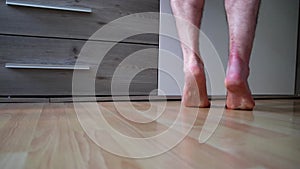 European man after achilles tendon rupture operation trains his healing achilles tendon with painful exercise to regain strength