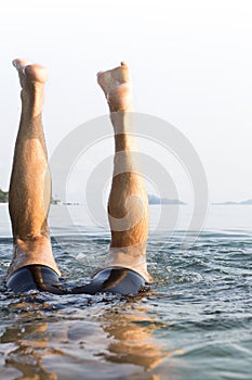 A European man diving underwater at Koh Mak, Tra