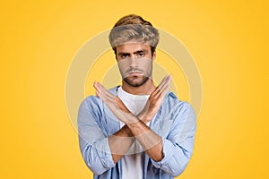 European man with no gesture on yellow background.