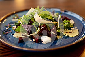 European Mediterranean salad of seasonal vegetables. Salad of tomatoes, cucumbers and fresh herbs with olive oil. Concept menu of