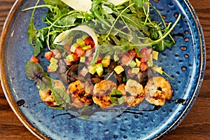 European Mediterranean salad of seasonal vegetables. Salad of tomatoes, cucumbers and fresh herbs with olive oil. Concept menu of