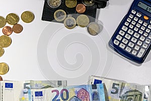 European money with black wallet on white desk as white background with different euro coins and euro bank notes with calculator f