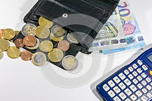 European money with black wallet on white desk as white background with different euro coins and euro bank notes with calculator f