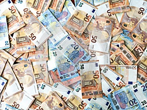 European money fifty and twenty euro bills, euro money overflowing background, euro bank notes
