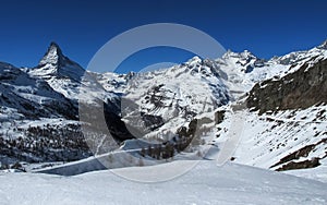 European mountains landscape, Alps, Italy, mountain skiing resort, picturesque view with deep blue sky, high rock peaks on horizon