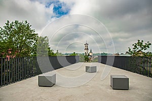 European old city landmark architecture balcony top view point with concrete floor foreground and historical city center tower