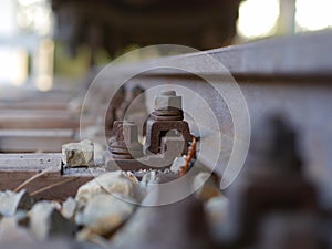 European rail construction with a rusty and nut