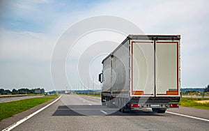 A European road train is traveling with a semitrailer on the motorway. Concept of useful volume in road trains and cargo