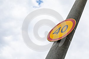 European roadsign Speed limit forty against cloudy sky