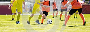 European soccer match between youth teams. Young school boys playing a soccer game