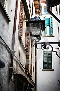 European street lamp in an empty alley in Bellagio