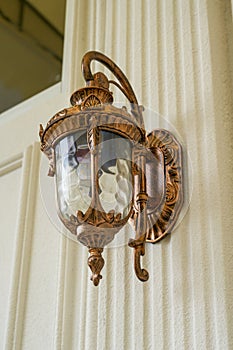 European style hanging lamp on building wall