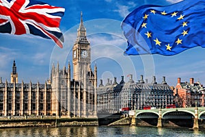 European Union and British Union flag flying against Big Ben in London, England, UK, Stay or leave, Brexit