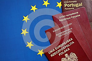 European union countries passports on blue EU flag close up